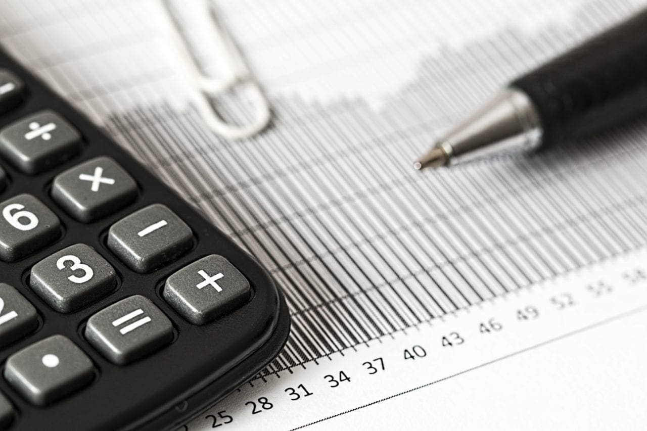 calculator ad pen business financial planning 